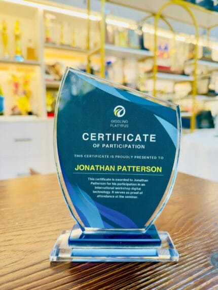 Custom blue crystal participation plaque with a clear crystal base