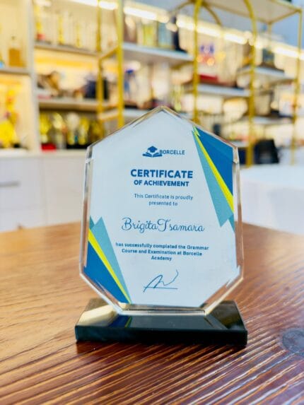 Custom crystal certificate plaque with a pointed top, clipped corners and black base