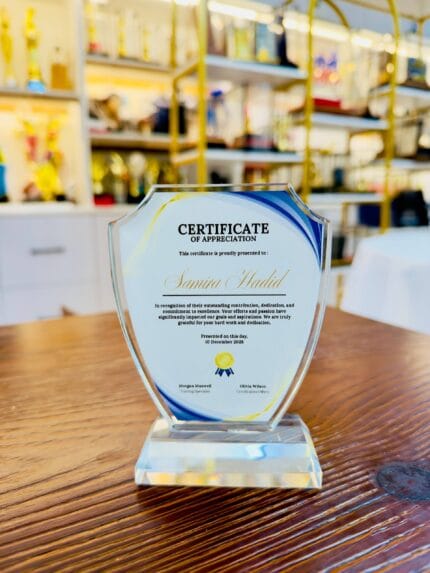 Custom crystal appreciation plaque with a wide shield silhouette and clear crystal base
