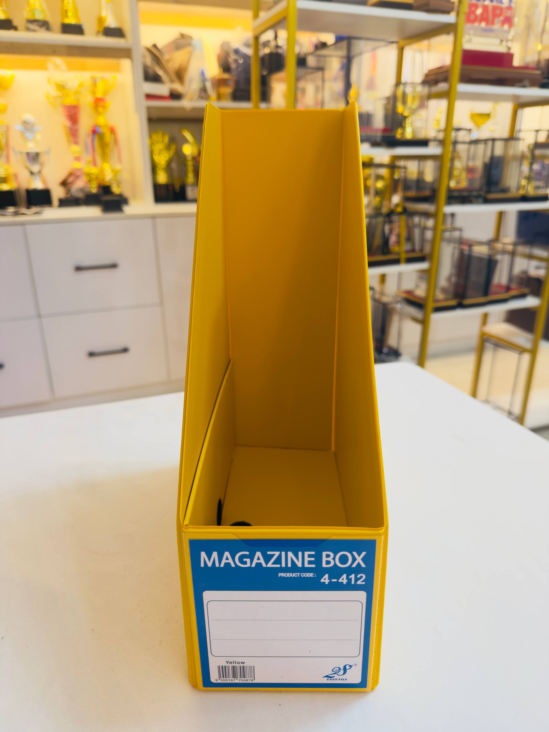 Yellow upright magazine-style file holder showing its open storage compartment